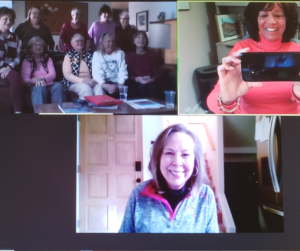 Photo shows award-winning author Patricia Raybon, smiling as she mees by Zoom -- and taking a photo with her smart phone -- with smiling book club members in Alamogordo, New Mexico.